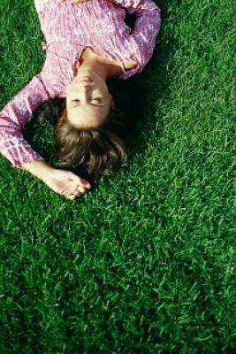 woman relaxing on lawn